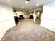 Finished basement featuring neutral carpeting, projector and desk area at 4414 Hickory Grove Blvd, Greenwood, IN 46143