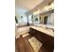 Elegant bathroom featuring a soaking tub, double vanity, and contemporary lighting at 4414 Hickory Grove Blvd, Greenwood, IN 46143