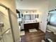 Bright bathroom featuring a modern vanity, large mirror, and luxurious shower at 4414 Hickory Grove Blvd, Greenwood, IN 46143