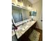 Bathroom boasts granite countertops, dual sinks, and updated fixtures, creating a spa-like retreat at 4414 Hickory Grove Blvd, Greenwood, IN 46143