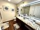 Modern bathroom with granite countertop, decorative wall art, and decorative shelving at 4414 Hickory Grove Blvd, Greenwood, IN 46143