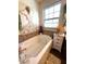 Serene bathtub setting with decorative accents and a relaxing ambiance at 4414 Hickory Grove Blvd, Greenwood, IN 46143