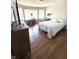 Comfortable bedroom with hardwood floors, large windows, and a cozy bed setup at 4414 Hickory Grove Blvd, Greenwood, IN 46143