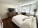 Bedroom featuring hardwood floors, a bay window, and a modern ceiling light at 4414 Hickory Grove Blvd, Greenwood, IN 46143