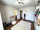 Bright bedroom featuring hardwood floors, a modern ceiling light, and a walk-in closet at 4414 Hickory Grove Blvd, Greenwood, IN 46143