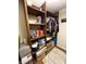 This walk-in closet features built-in shelving, hanging rods, and an area to store personal belongings at 4414 Hickory Grove Blvd, Greenwood, IN 46143