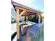 Outdoor covered patio with wood frame, grill, and comfortable lounge seating at 4414 Hickory Grove Blvd, Greenwood, IN 46143