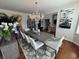 Open-concept dining room showcasing a modern chandelier and elegant furniture at 4414 Hickory Grove Blvd, Greenwood, IN 46143