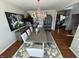 Elegant dining room with chandelier, hardwood floors, stylish decor, and lots of room for hosting at 4414 Hickory Grove Blvd, Greenwood, IN 46143