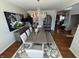 Elegant dining room features a modern chandelier, wood table, and stylish decor at 4414 Hickory Grove Blvd, Greenwood, IN 46143