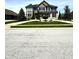 Charming two-story home with a well-manicured lawn, lush landscaping, and a welcoming curb appeal at 4414 Hickory Grove Blvd, Greenwood, IN 46143