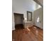 Bright foyer with hardwood floors and decorative mirror over the entryway table at 4414 Hickory Grove Blvd, Greenwood, IN 46143