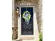Close up of a black front door with floral wreath at 4414 Hickory Grove Blvd, Greenwood, IN 46143
