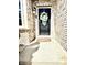 A charming front door adorned with a flower wreath and a warm, inviting ambiance at 4414 Hickory Grove Blvd, Greenwood, IN 46143