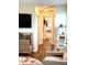 Inviting hallway leading to a stylish bathroom with a modern vanity and decor at 4414 Hickory Grove Blvd, Greenwood, IN 46143