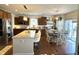 Spacious kitchen boasts stainless steel appliances, granite counters, and adjacent dining area at 4414 Hickory Grove Blvd, Greenwood, IN 46143