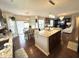 Bright, open kitchen and dining area is perfect for entertaining, featuring a kitchen island at 4414 Hickory Grove Blvd, Greenwood, IN 46143