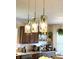Kitchen details include unique pendant lighting, modern appliances, and open shelving at 4414 Hickory Grove Blvd, Greenwood, IN 46143