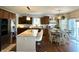 Stylish kitchen with island, granite counters, stainless appliances, and an adjacent dining area at 4414 Hickory Grove Blvd, Greenwood, IN 46143