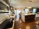 Well-lit kitchen featuring hardwood floors, granite counters, stainless appliances, and a breakfast nook at 4414 Hickory Grove Blvd, Greenwood, IN 46143