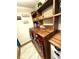 A laundry room with butcher block countertops, built-in shelving, a sink, and a red washer and dryer at 4414 Hickory Grove Blvd, Greenwood, IN 46143