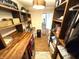 Well-equipped laundry room has wood countertops, shelving, a sink, and a front-load washer and dryer at 4414 Hickory Grove Blvd, Greenwood, IN 46143