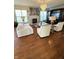 Open living room featuring hardwood floors, a fireplace and a large entertainment center at 4414 Hickory Grove Blvd, Greenwood, IN 46143