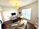 Office space with wood floors, a window, desk and shelving providing a functional and comfortable workspace at 4414 Hickory Grove Blvd, Greenwood, IN 46143