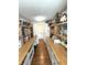 Spacious pantry featuring custom shelving and ample storage space at 4414 Hickory Grove Blvd, Greenwood, IN 46143