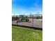 Community playground area featuring slides and play equipment, fully enclosed by a fence at 4414 Hickory Grove Blvd, Greenwood, IN 46143