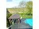 Backyard oasis with a sparkling pool, cabana, and view of the community walking trails at 4414 Hickory Grove Blvd, Greenwood, IN 46143