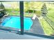 Stunning pool area with crystal-clear water, lounge chairs, and well-manicured landscaping at 4414 Hickory Grove Blvd, Greenwood, IN 46143