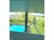 Breathtaking view of the outdoor pool surrounded by lush greenery and blue skies at 4414 Hickory Grove Blvd, Greenwood, IN 46143