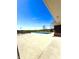 Community pool area with a large pool covered for the off-season and open green space at 4414 Hickory Grove Blvd, Greenwood, IN 46143