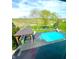 Backyard oasis with a sparkling pool, cabana, and view of the community walking trails at 4414 Hickory Grove Blvd, Greenwood, IN 46143