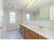 Bathroom featuring a double sink vanity, bathtub and window at 443 Quincy Pl, Westfield, IN 46074