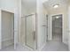 Bright bathroom with tiled floors, glass enclosed shower and walk-in closet access at 443 Quincy Pl, Westfield, IN 46074