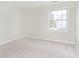 Neutral bedroom with light carpet and a window providing natural light at 443 Quincy Pl, Westfield, IN 46074