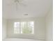 Bright bedroom with neutral carpet and large windows offering natural light at 443 Quincy Pl, Westfield, IN 46074