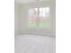 Well lit bedroom with neutral carpet, large window looking out on a green lawn at 443 Quincy Pl, Westfield, IN 46074