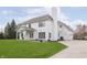 Stunning two-story white home with a well-manicured lawn and an attached garage at 443 Quincy Pl, Westfield, IN 46074