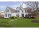 Beautiful white painted brick home with a well-maintained lawn and mature trees at 443 Quincy Pl, Westfield, IN 46074