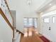 Bright foyer features a hardwood floor and staircase at 443 Quincy Pl, Westfield, IN 46074