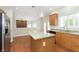 Kitchen with granite countertops, center island, stainless steel appliances, and open concept to living area at 443 Quincy Pl, Westfield, IN 46074