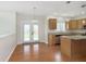 Bright kitchen features wood floors, granite counters, stainless steel appliances, and a center island at 443 Quincy Pl, Westfield, IN 46074