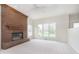 Spacious living room with a brick fireplace and natural light at 443 Quincy Pl, Westfield, IN 46074