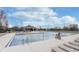 Large community swimming pool with lounge chairs, lifeguard chair, and a covered patio area at 443 Quincy Pl, Westfield, IN 46074