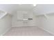 Large walk-in closet with carpeted floors, and custom built-in shelves and clothes racks at 443 Quincy Pl, Westfield, IN 46074