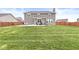 Beautiful backyard with patio, well-maintained lawn, and fenced perimeter for privacy at 474 Pekin Way, Pendleton, IN 46064