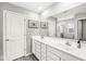 Bathroom features a double vanity, large mirror, and modern fixtures at 474 Pekin Way, Pendleton, IN 46064